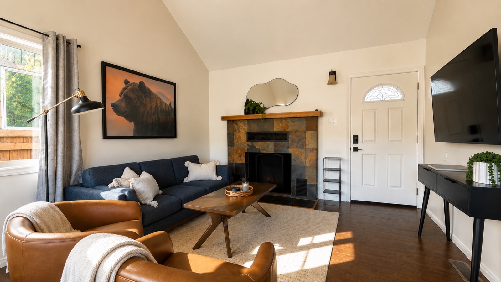 Living room with fireplace and leather chairs